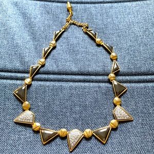 Geometric gold necklace with metallic and rhinestone shapes